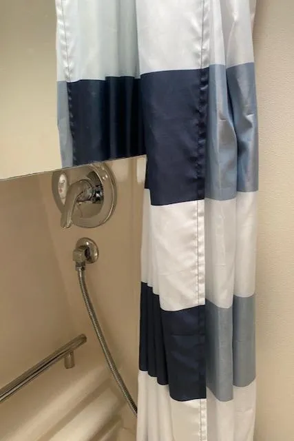 Slide: The Image of Shower area in 2005 Maxum 3500 SY boat with striped curtain. - 21