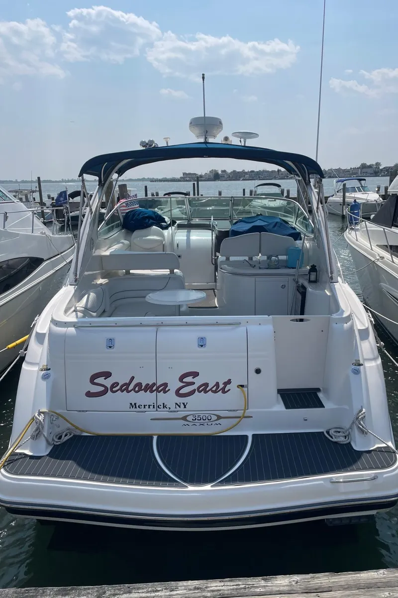 Slide: The Image of 2005 Maxum 3500 SY boat docked at a marina. - 22