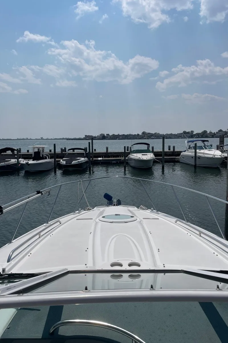 Slide: The Image of 2005 Maxum 3500 SY yacht docked at a marina on a sunny day. - 6