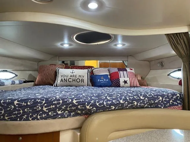 Slide: The Image of Cozy cabin interior of 2005 Maxum 3500 SY yacht with nautical-themed bedding. - 7