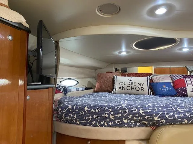 Slide: The Image of Interior cabin of a 2005 Maxum 3500 SY boat with cozy bedding and pillows. - 8