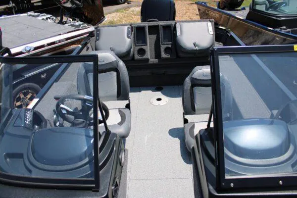 Slide: The Image of 2023 Lowe FM1675 boat interior with dual consoles and seating. - 5