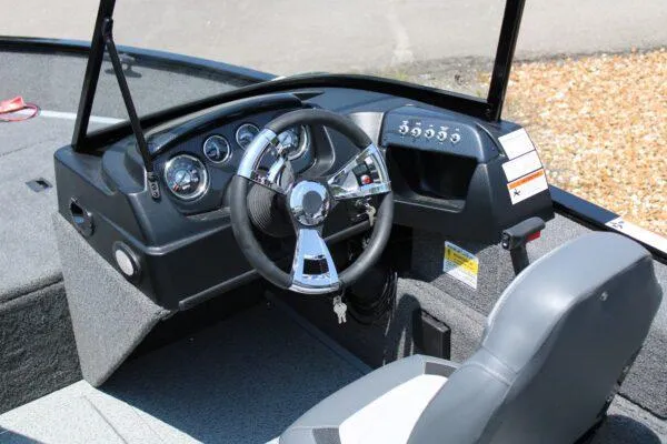 Slide: The Image of 2023 Lowe FM1675 boat dashboard and steering wheel. - 9