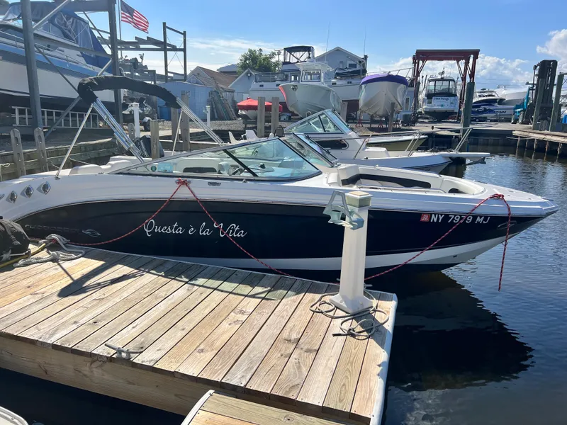 The Image of 2013 Chaparral 246 SSi boat docked at a marina. - 0