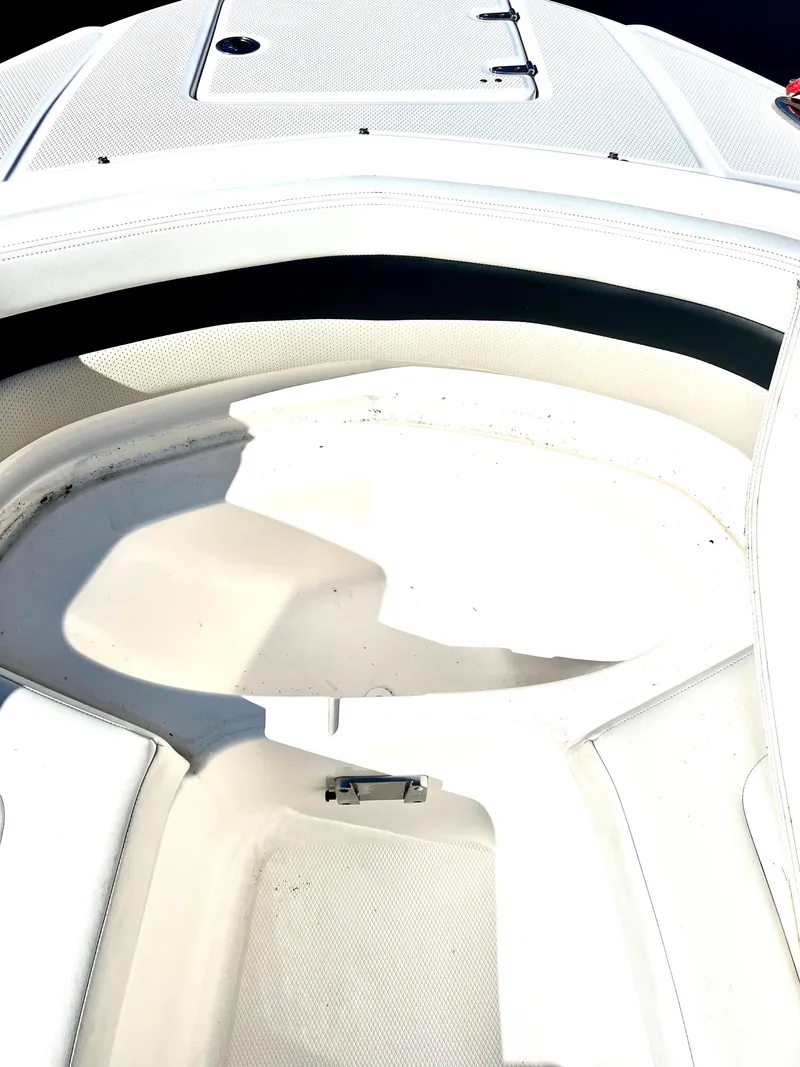 Slide: The Image of 2013 Chaparral 246 SSi boat interior, white seating area. - 11