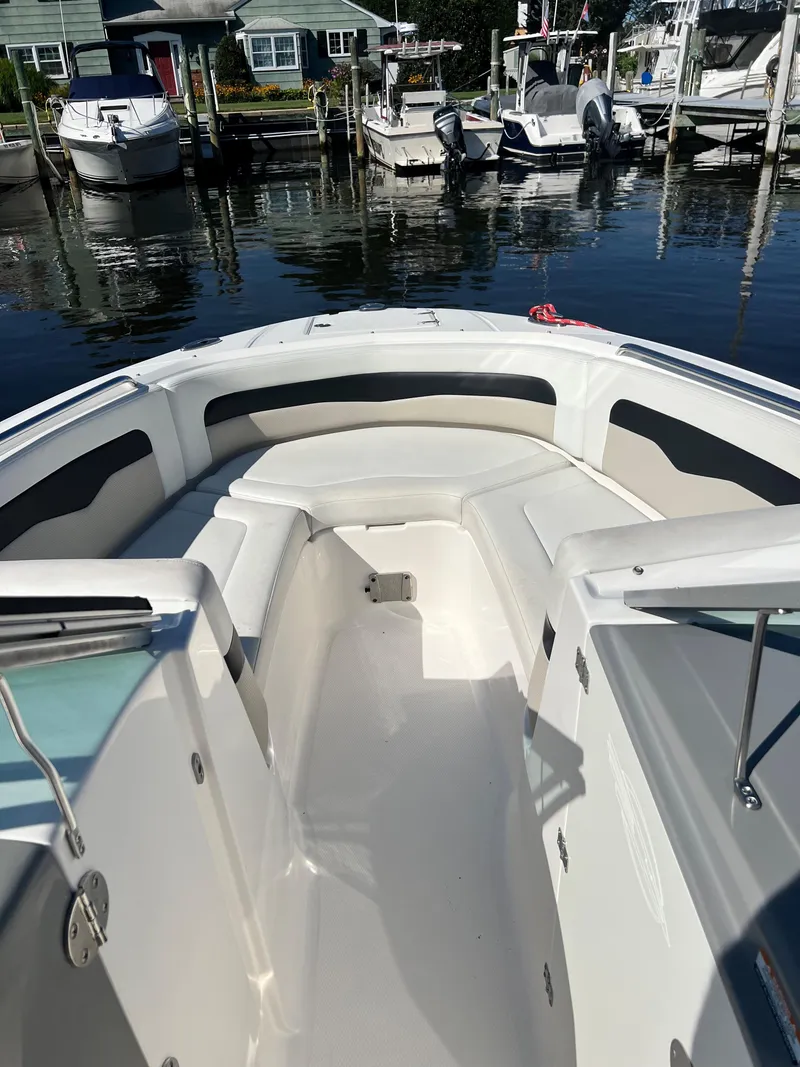 Slide: The Image of 2013 Chaparral 246 SSi boat docked at a marina. - 5