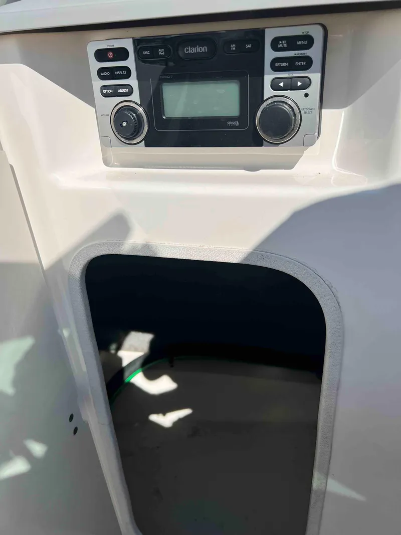 Slide: The Image of 2013 Chaparral 246 SSi boat interior with Clarion stereo system. - 6