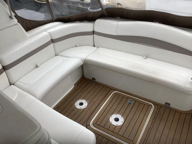 Slide: The Image of 2001 Formula 40 PC boat interior with white leather seating and wooden flooring. - 11