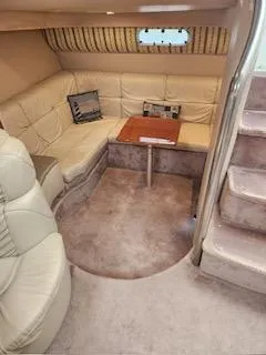 Slide: The Image of 2001 Formula 40 PC yacht interior with beige seating and wooden table. - 15