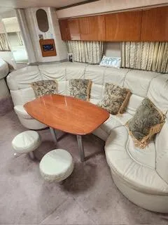 Slide: The Image of 2001 Formula 40 PC yacht interior with leather seating and wooden table. - 17