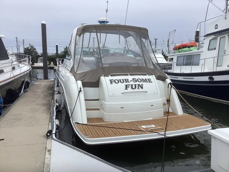 Slide: The Image of 2001 Formula 40 PC yacht docked at marina, named Four-Some Fun. - 2