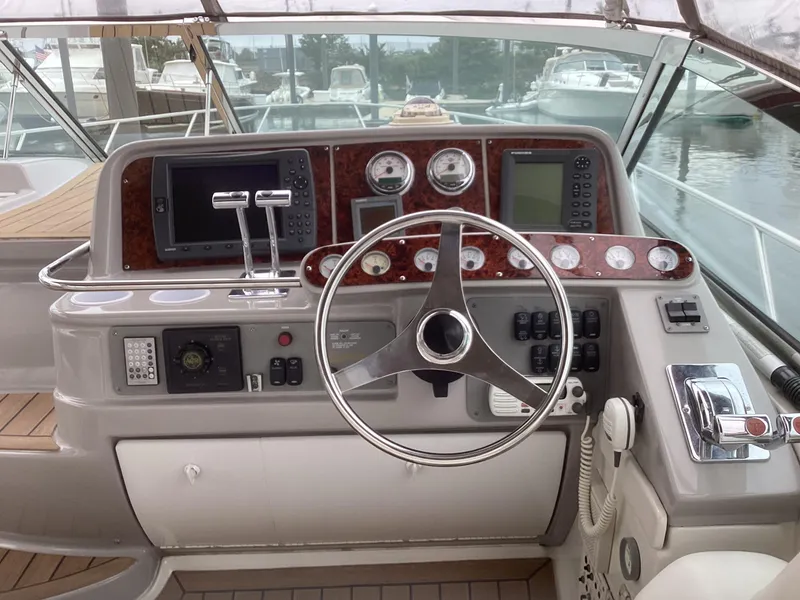 Slide: The Image of 2001 Formula 40 PC boat helm with steering wheel and navigation instruments. - 7