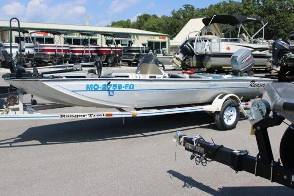 Slide: The Image of 1994 Ranger Cherokee boat on trailer at marina, side view. - 8
