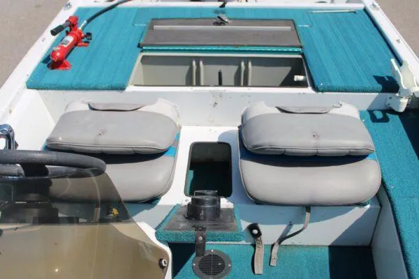 Slide: The Image of 1994 Ranger Cherokee boat interior with dual seats and fire extinguisher. - 9