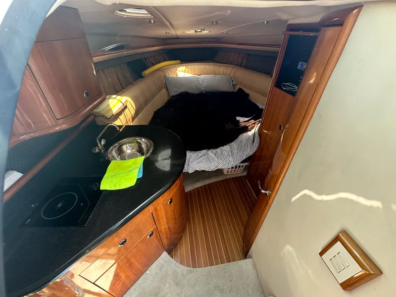 Slide: The Image of Interior cabin of a 2005 Cobalt 360 Cruiser with kitchenette and bed. - 10
