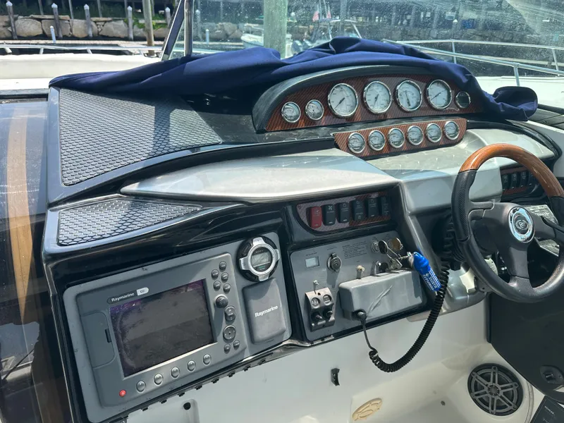 Slide: The Image of 2005 Cobalt 360 Cruiser dashboard with navigation and control instruments. - 13