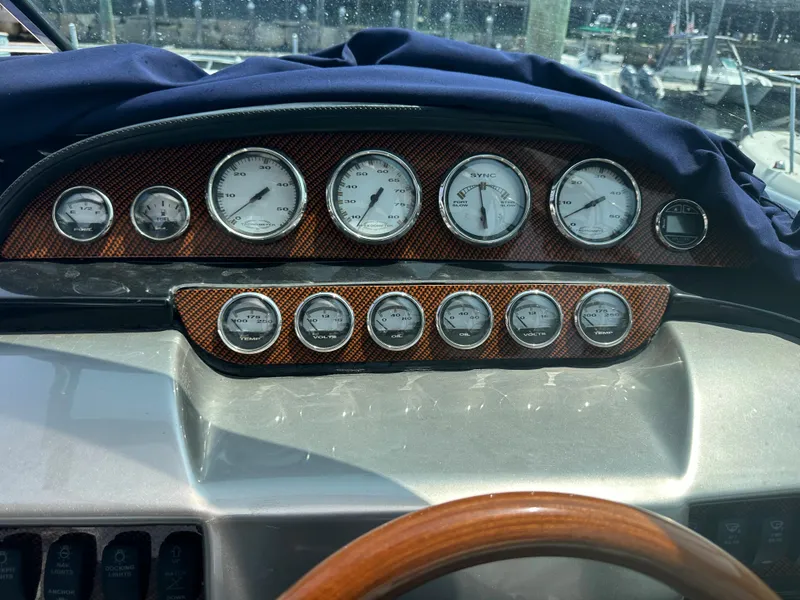 Slide: The Image of Dashboard of a 2005 Cobalt 360 Cruiser with gauges and controls. - 14