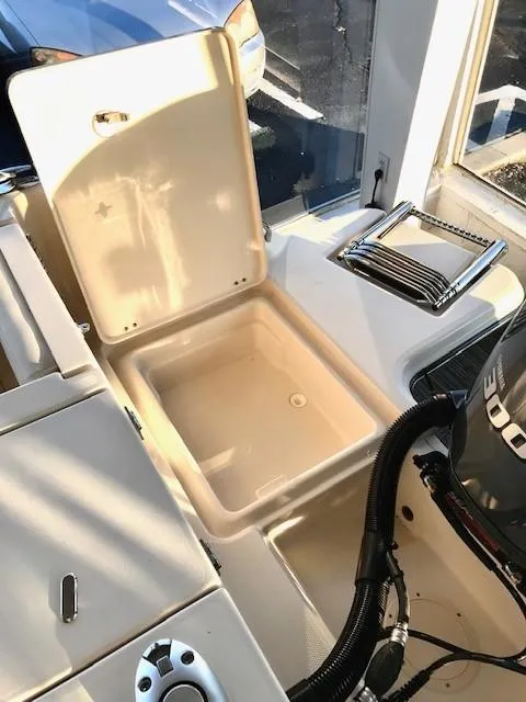 Slide: The Image of 2024 Grady-White Freedom 235 boat storage compartment and engine area. - 15
