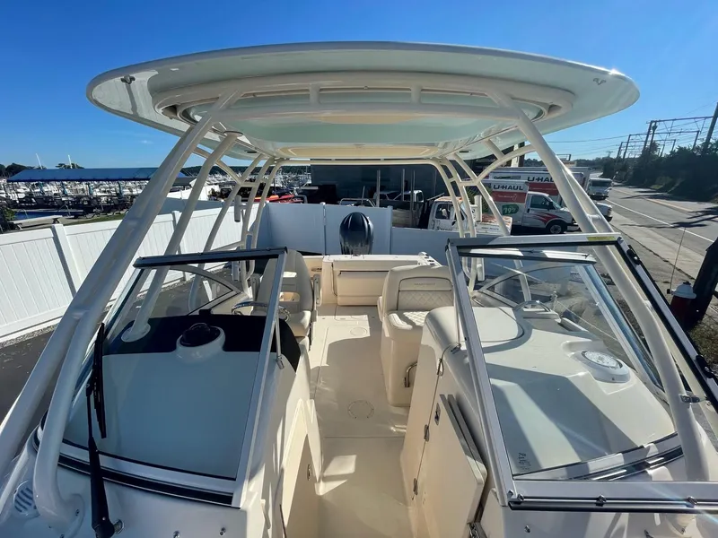 Slide: The Image of 2024 Grady-White Freedom 235 boat interior with dual consoles and hardtop. - 3