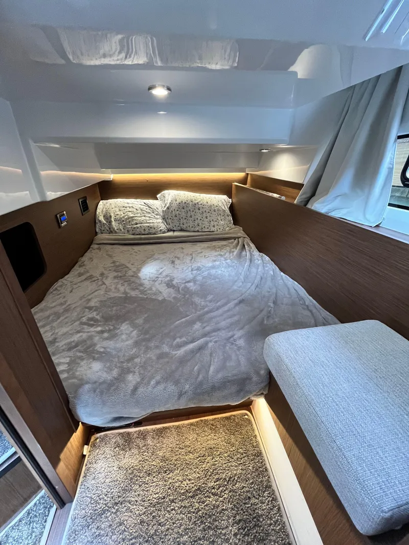 Slide: The Image of Cozy bedroom interior of 2022 Jeanneau NC 1095 boat with modern design. - 21