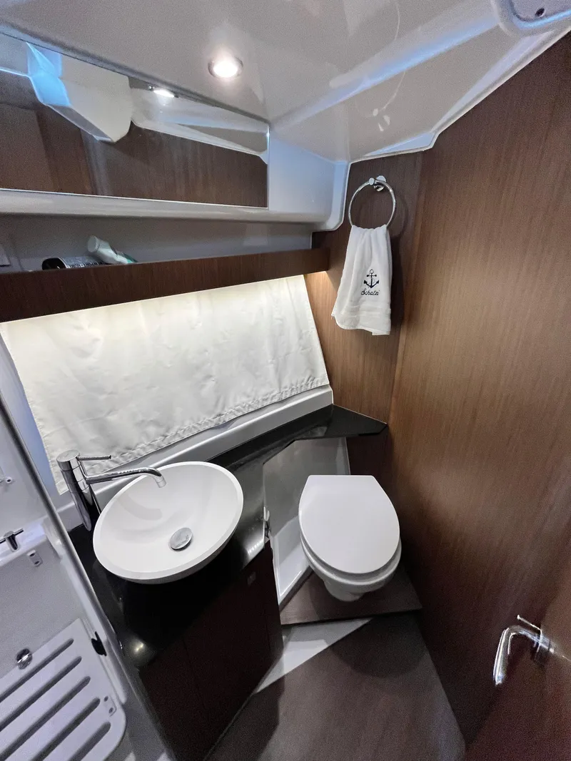Slide: The Image of 2022 Jeanneau NC 1095 bathroom with modern sink, toilet, and wooden accents. - 23