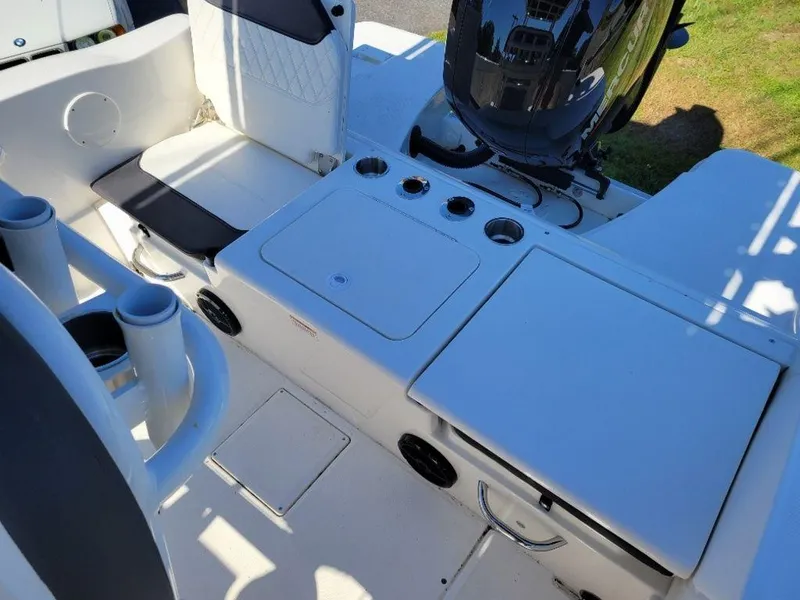 Slide: The Image of 2024 Bayliner Trophy 20 boat interior with seating and storage compartments. - 11