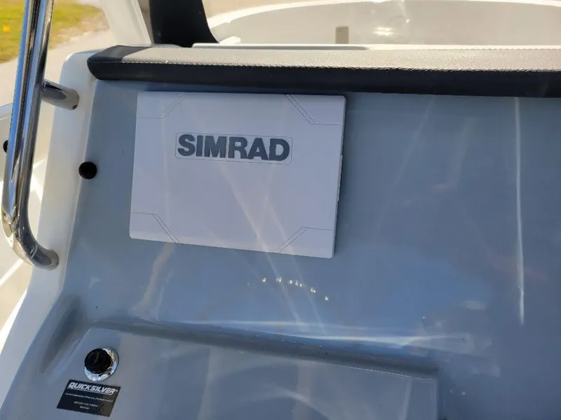 Slide: The Image of 2024 Bayliner Trophy 20 dashboard with Simrad navigation system. - 15