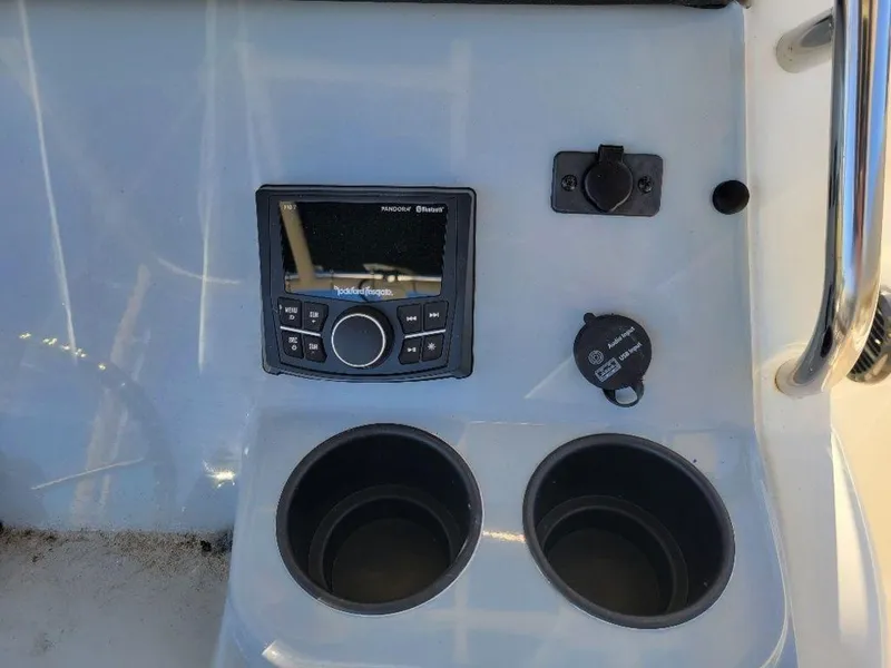Slide: The Image of Control panel and cup holders on 2024 Bayliner Trophy 20 boat. - 16