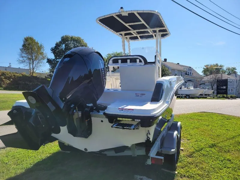 Slide: The Image of 2024 Bayliner Trophy 20 boat with outboard motor on trailer. - 6