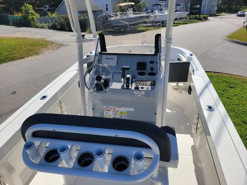 Slide: The Image of 2024 Bayliner Trophy 20 boat cockpit with steering wheel and control panel. - 8
