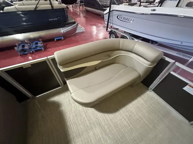 Slide: The Image of 2024 Bennington 198 SLJ boat interior seating area with beige upholstery. - 10