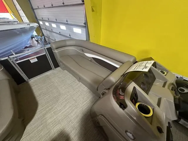 Slide: The Image of 2024 Bennington 198 SLJ pontoon boat interior with gray seating and helm station. - 11