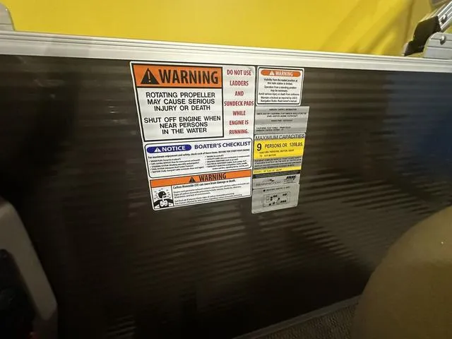 Slide: The Image of Warning labels on a 2024 Bennington 198 SLJ boat. - 12