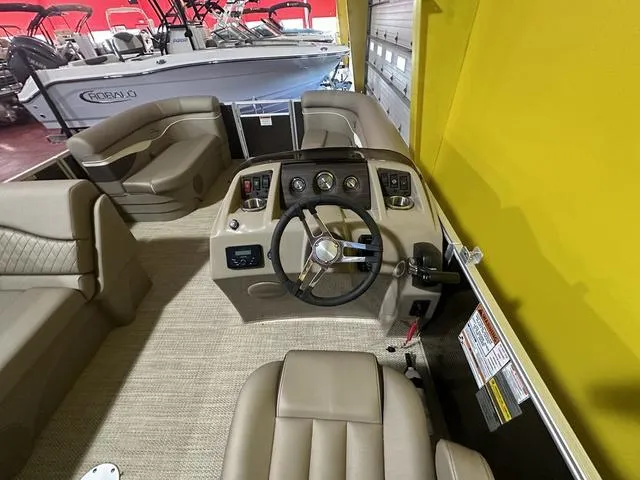 Slide: The Image of 2024 Bennington 198 SLJ boat interior with steering console and seating. - 14