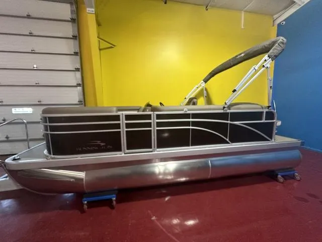Slide: The Image of 2024 Bennington 198 SLJ pontoon boat in showroom. - 3