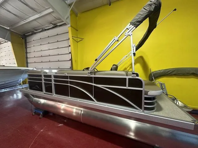 Slide: The Image of 2024 Bennington 198 SLJ pontoon boat in indoor storage. - 5