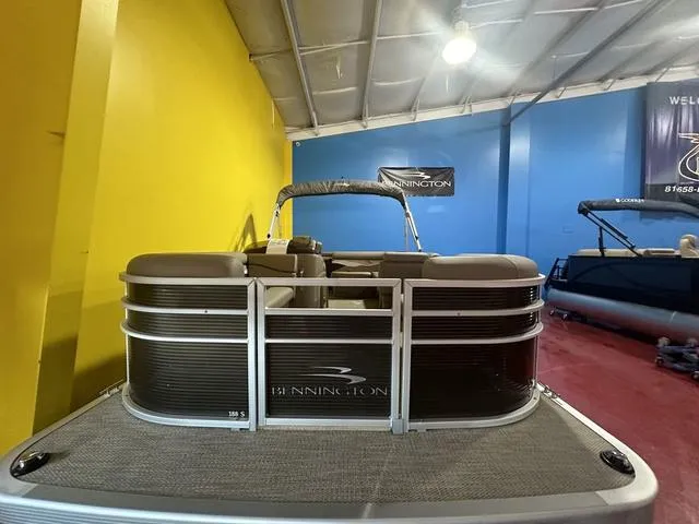 Slide: The Image of 2024 Bennington 198 SLJ pontoon boat in showroom, front view. - 6