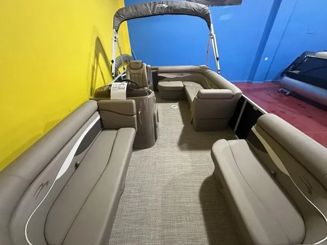 Slide: The Image of 2024 Bennington 198 SLJ pontoon boat interior with spacious seating and canopy. - 7