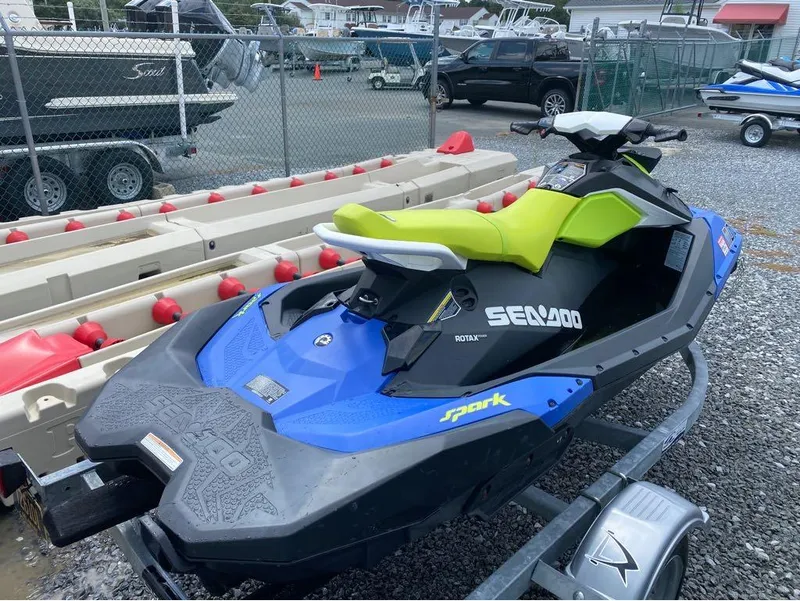 Slide: The Image of 2021 Sea-Doo SPARK 3 UP 90 with iBR on a trailer in a boatyard. - 4