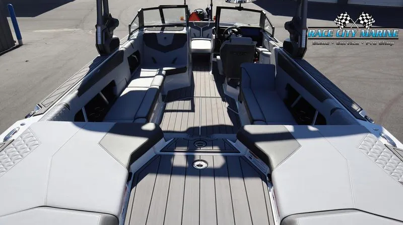 Slide: The Image of 2024 Nautique GS24 boat interior with spacious seating and modern design. - 11