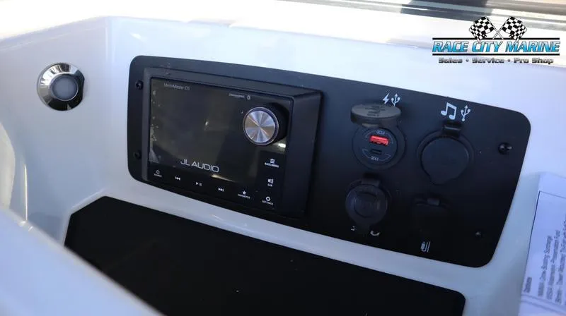 Slide: The Image of 2024 Nautique GS24 boat audio control panel with JL Audio system. - 12