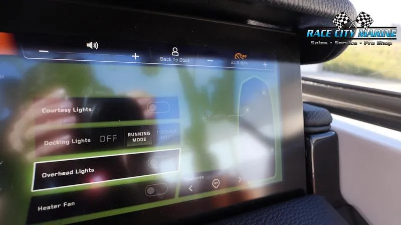Slide: The Image of 2024 Nautique GS24 touchscreen control panel displaying light and fan settings. - 17