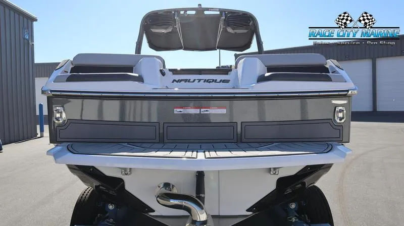 Slide: The Image of 2024 Nautique GS24 boat rear view at Race City Marine dealership. - 18