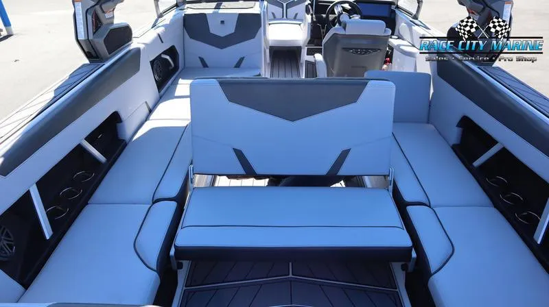 Slide: The Image of 2024 Nautique GS24 boat interior with spacious seating and modern design. - 2