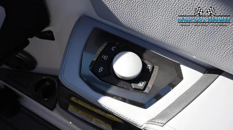 Slide: The Image of 2024 Nautique GS24 boat control panel with Race City Marine logo. - 20