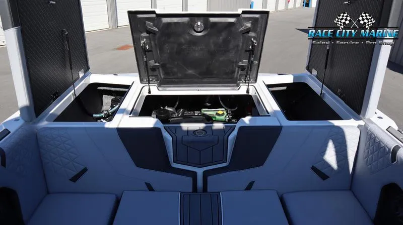 Slide: The Image of 2024 Nautique GS24 boat storage compartments open at Race City Marine. - 23