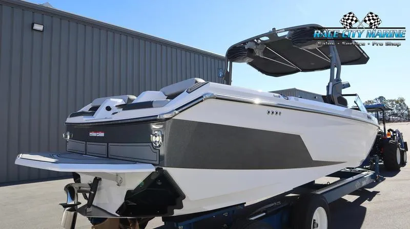Slide: The Image of 2024 Nautique GS24 boat at Race City Marine dealership. - 24