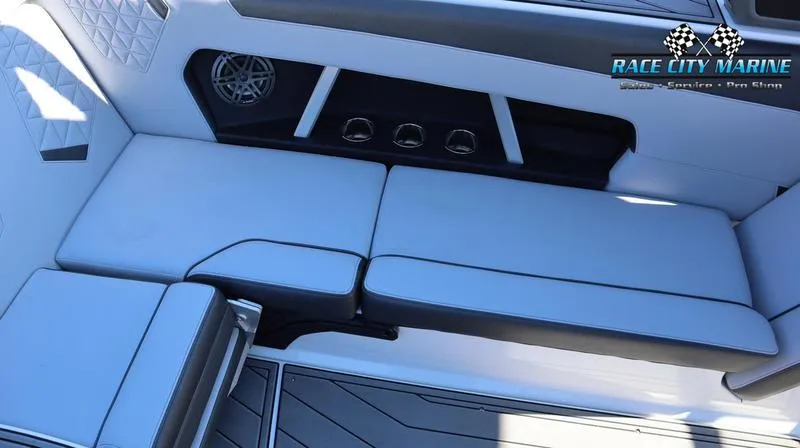 Slide: The Image of 2024 Nautique GS24 boat interior seating with Race City Marine branding. - 28