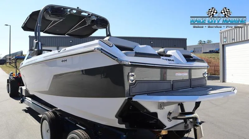 Slide: The Image of 2024 Nautique GS24 boat on trailer at Race City Marine dealership. - 3