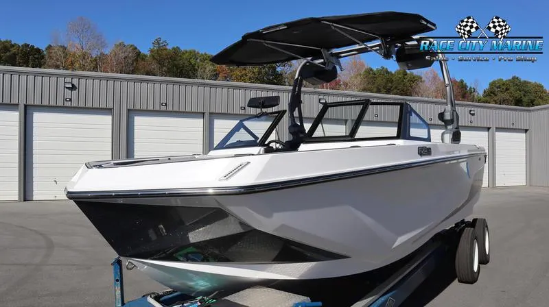 Slide: The Image of 2024 Nautique GS24 boat on trailer at Race City Marine dealership. - 30